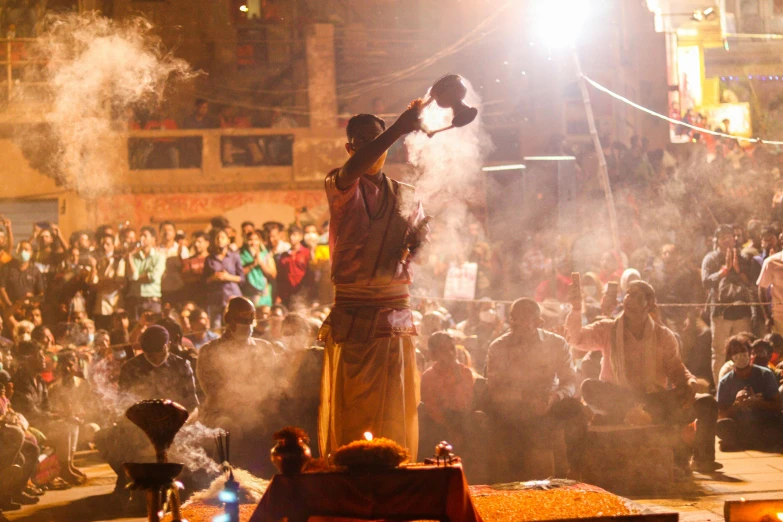 people on stage, in a crowd of people