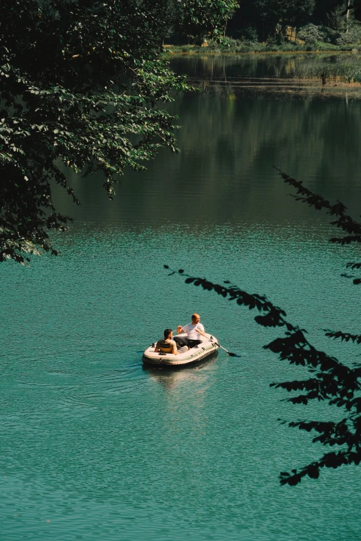 a small boat that is floating on some water