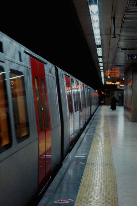 a long train moving on a track through a building