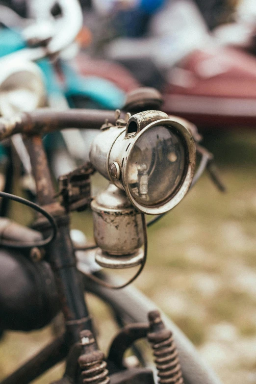 the front of a motor bike with a lamp on it