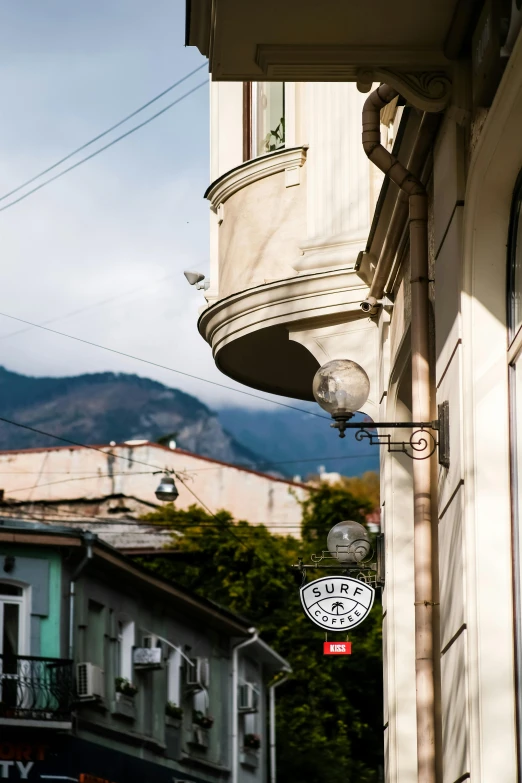 two buildings sit side by side on a town street