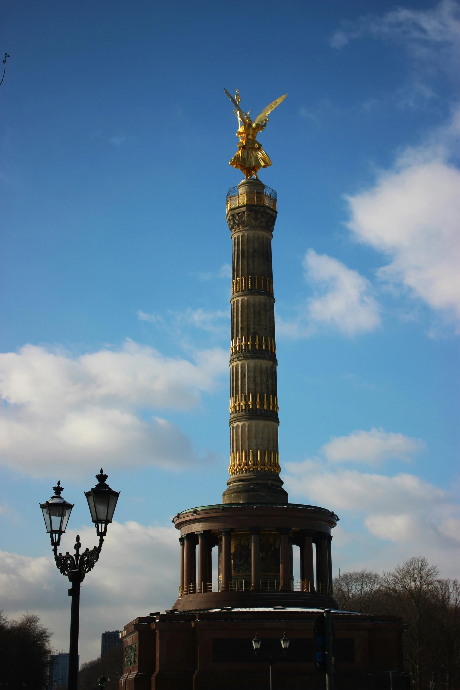 there is a golden sculpture at the base of this building