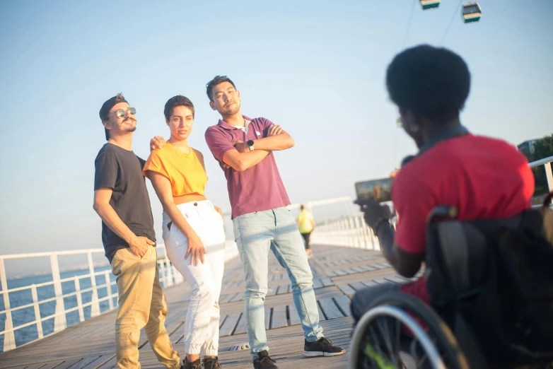 the group of men are posing on the deck