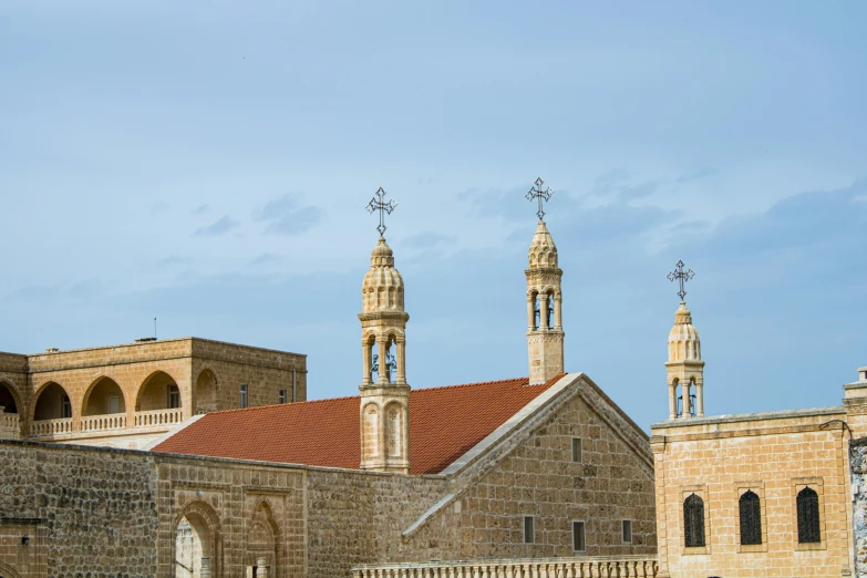 the top of an old church with an clock