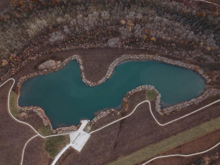 a large lake is shown with a trail in front