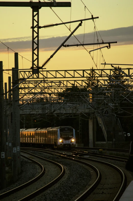 train on tracks with sky and train in background