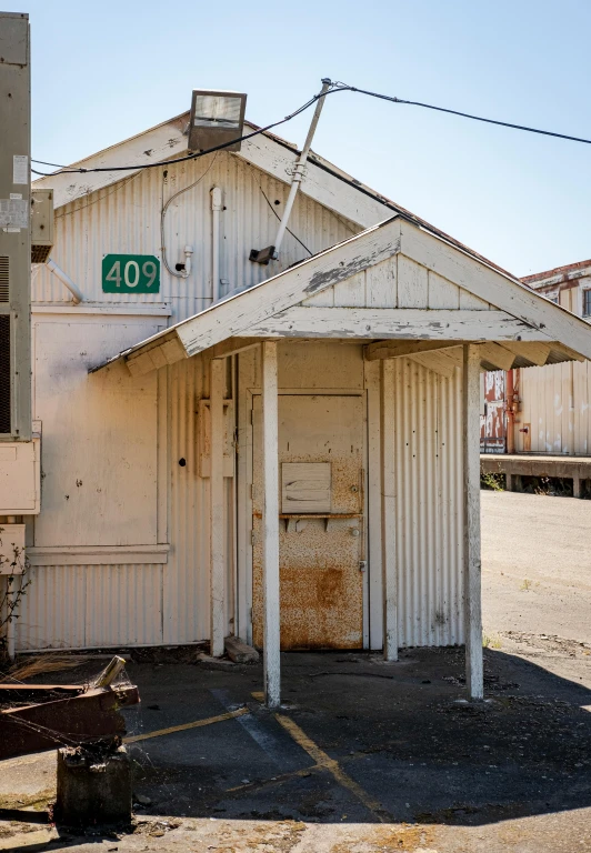 an old building with a couple of signs on the door