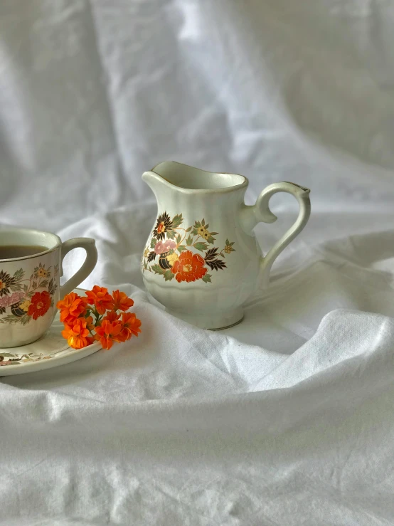 two old fashion cups and saucers sitting next to each other