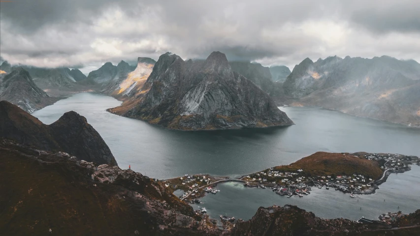 view of small village surrounded by mountain range