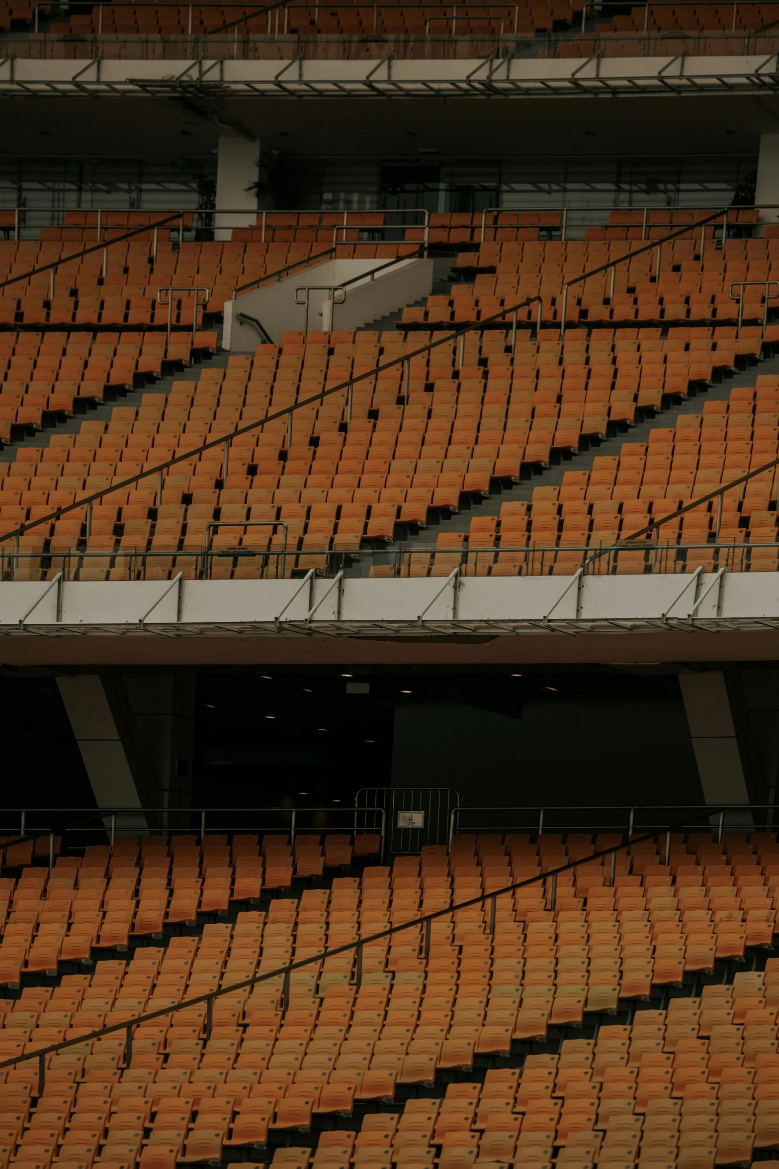 the interior of an arena with many rows of seats