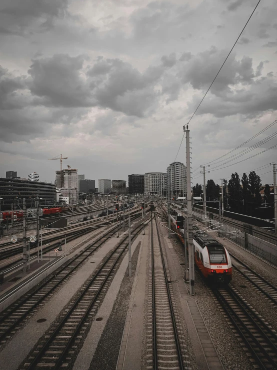 a commuter train on the tracks in a city