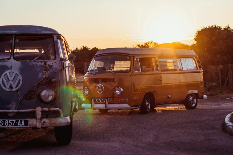 a van and van is parked on the road in front of each other