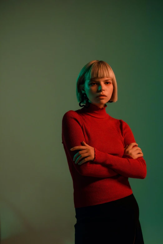 a woman wearing red is posing for the camera