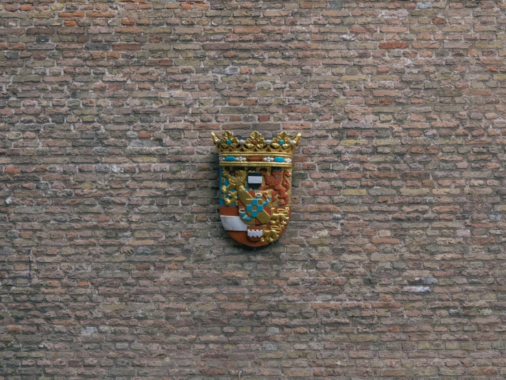 a coat of arms is made of bricks
