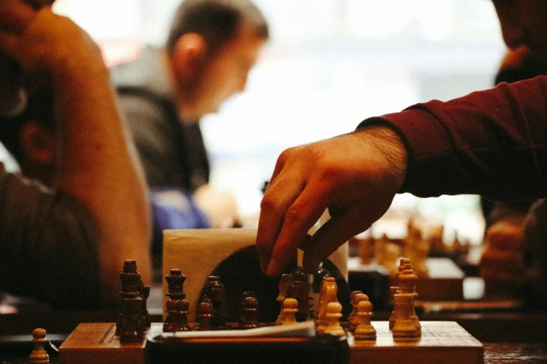 a chess board is playing with two people