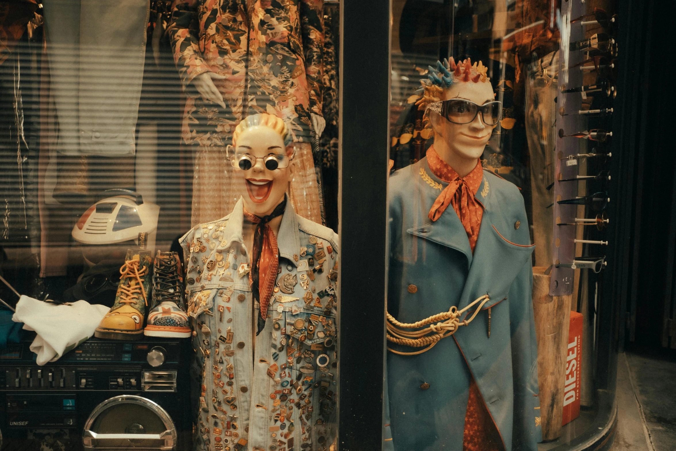 a display case filled with mannequins in old clothes