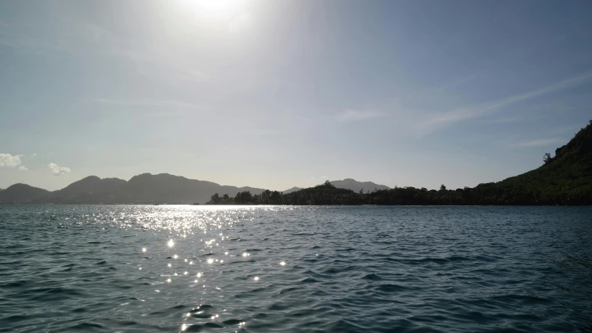 an island in the water, on a clear day