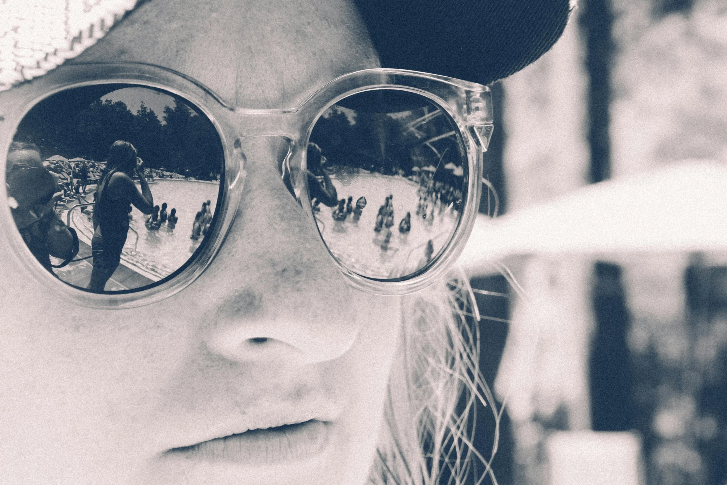 black and white image of woman wearing sunglasses in winter time