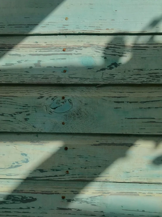 a shadow of a person holding an umbrella