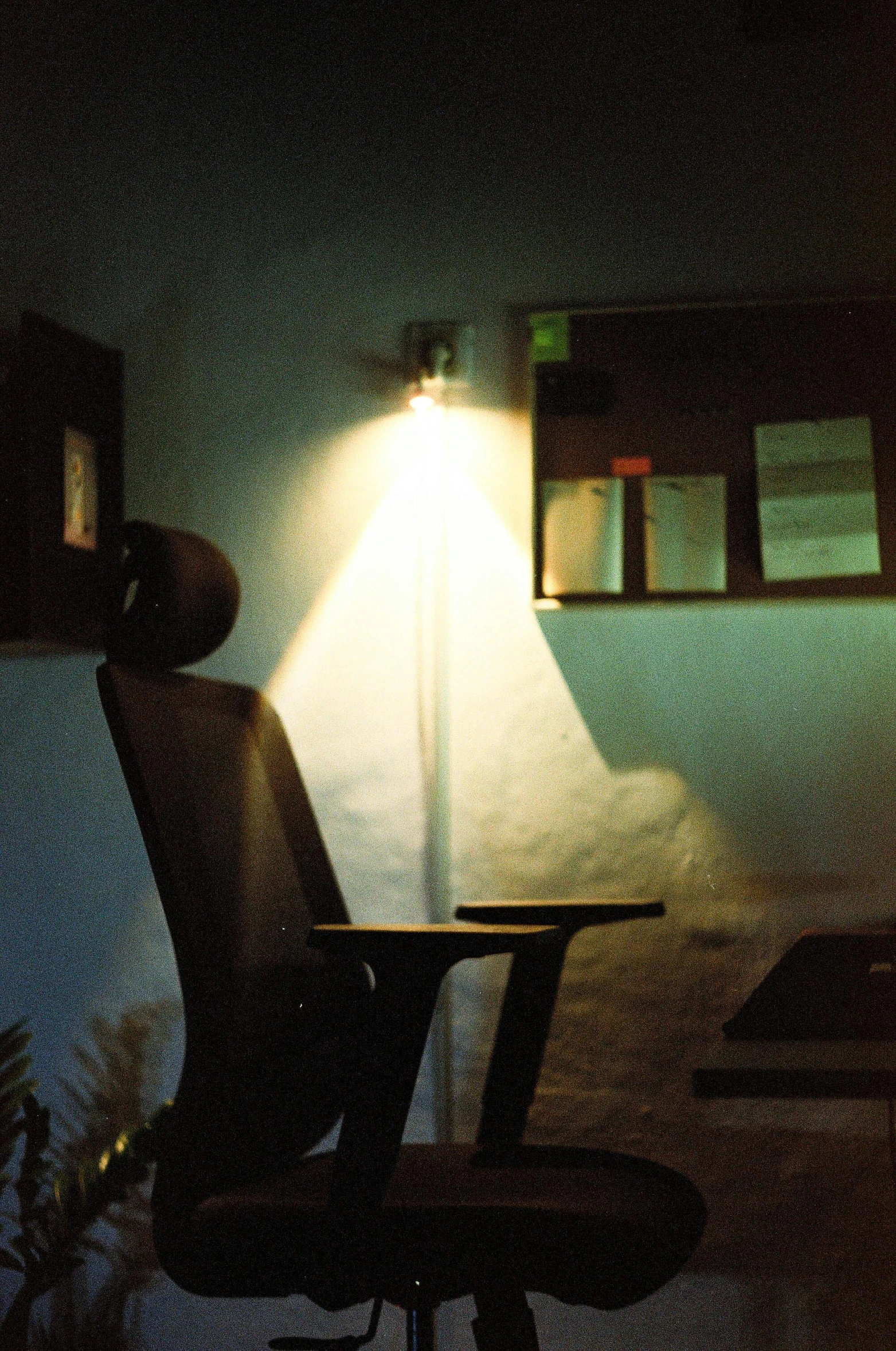 a man sitting at a desk with his head down