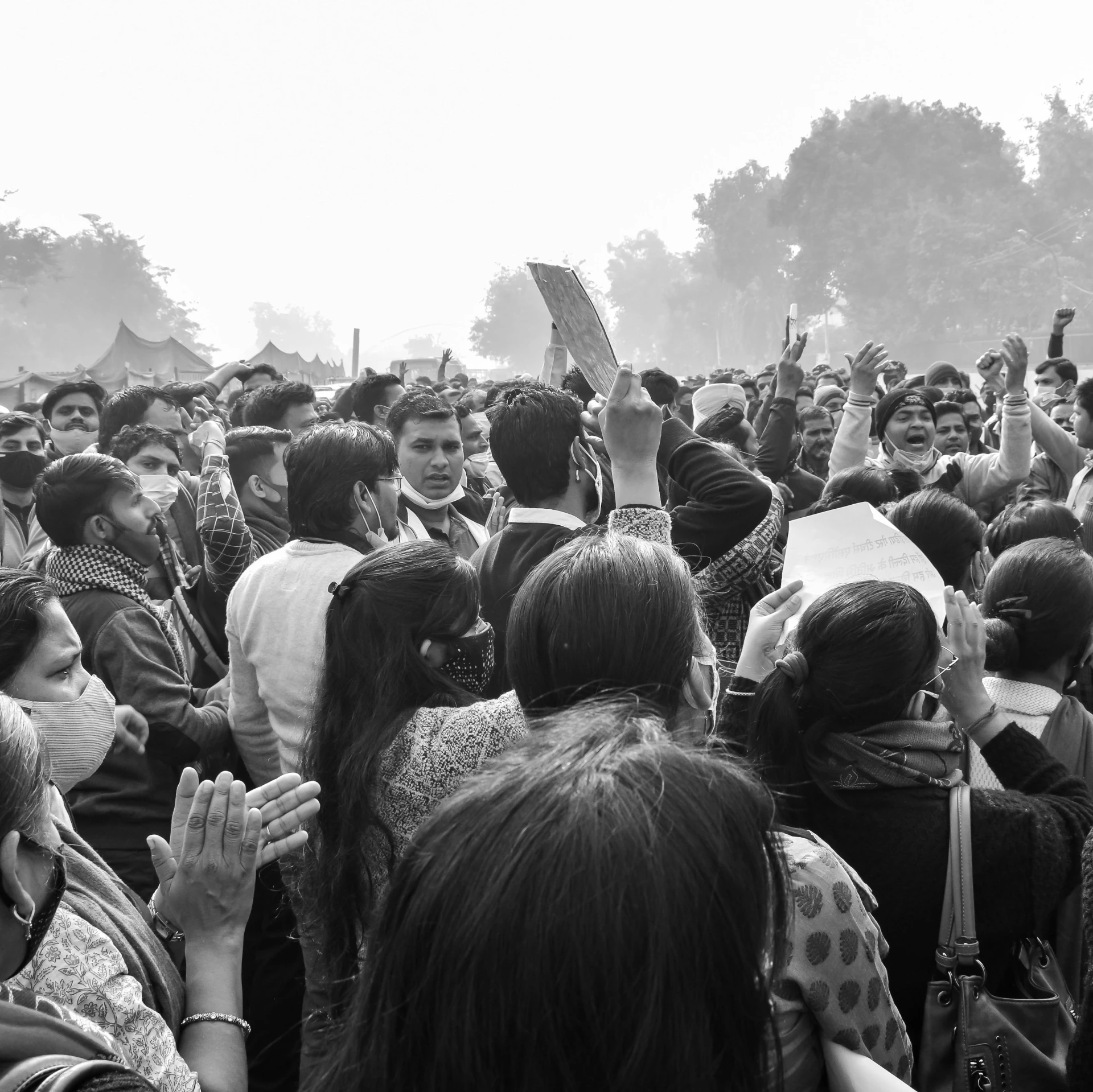 a lot of people are standing together in the street