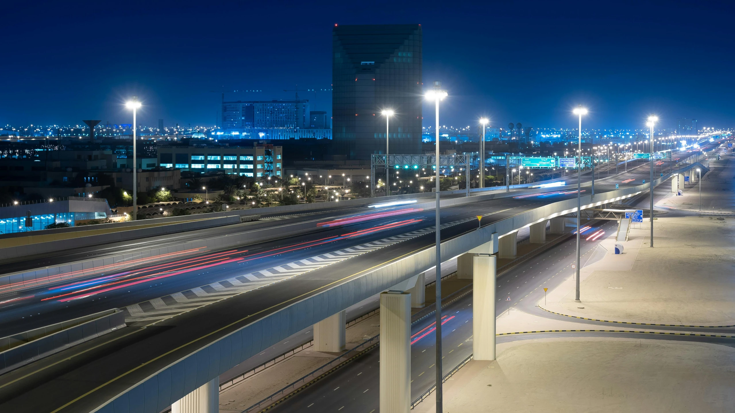 a wide highway with several long lights on top