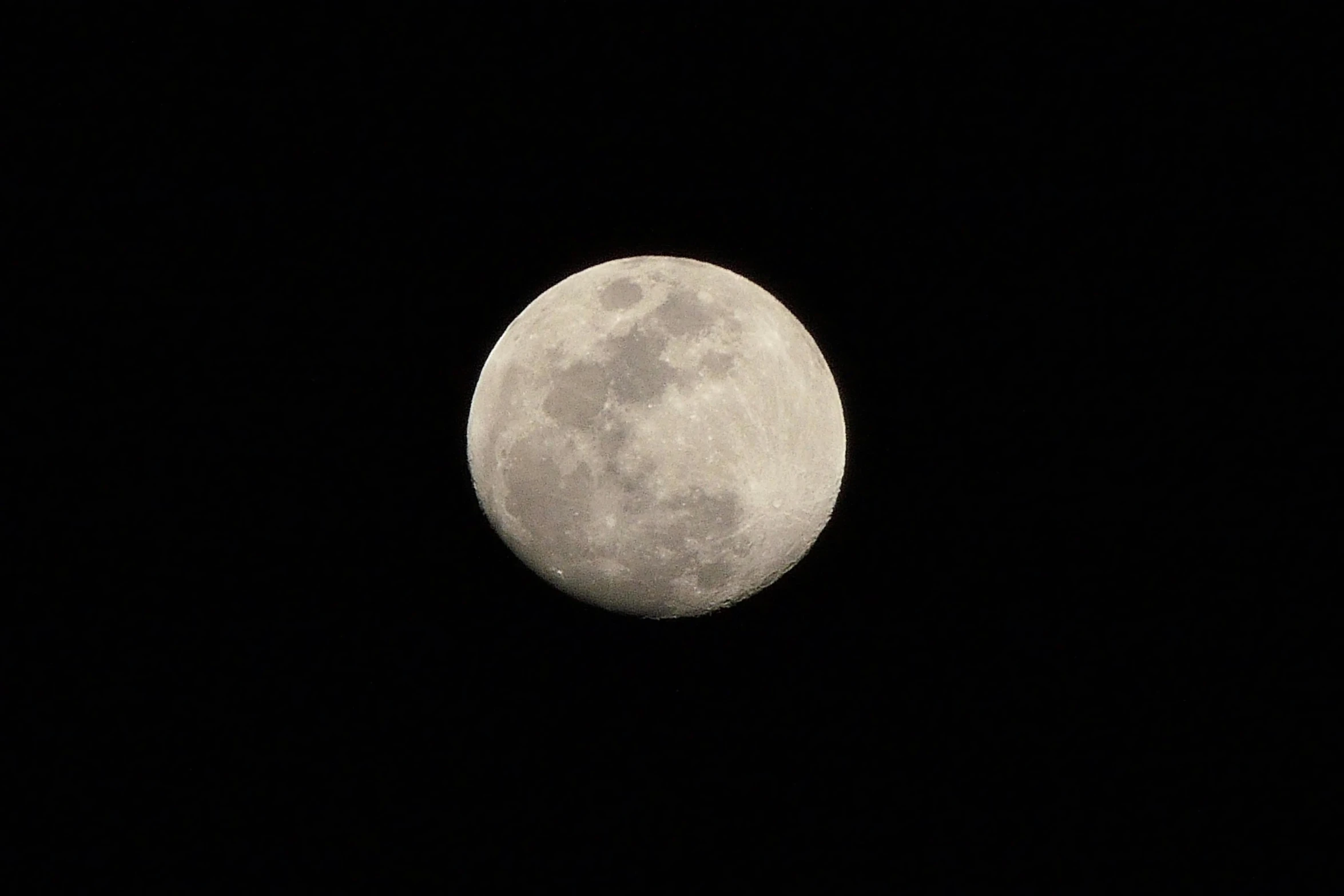 a very big moon with no clouds in the sky