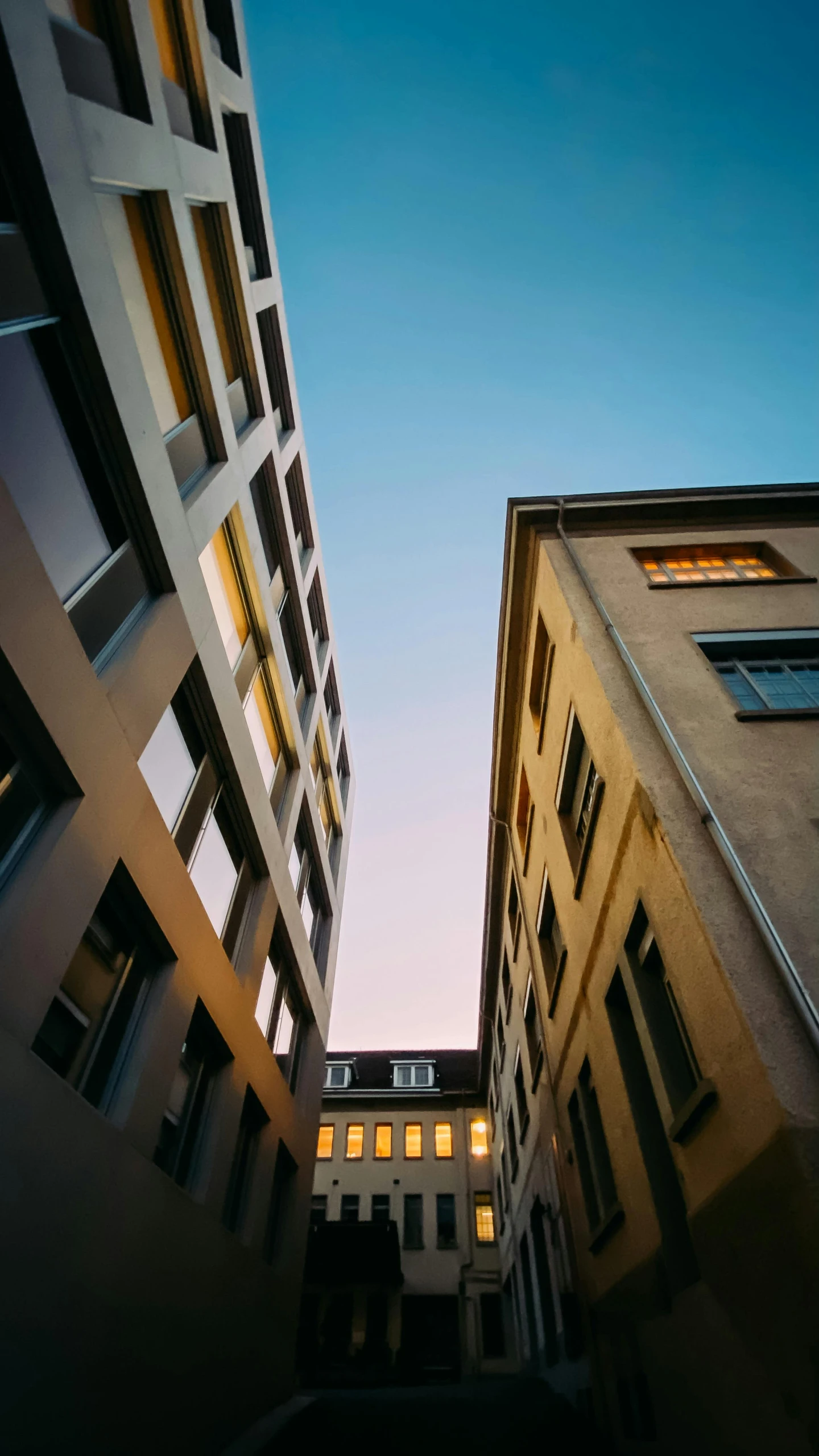 low angle s of buildings in a courtyard area at dusk