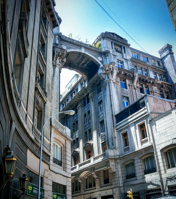 an intersection with multiple buildings and a bridge