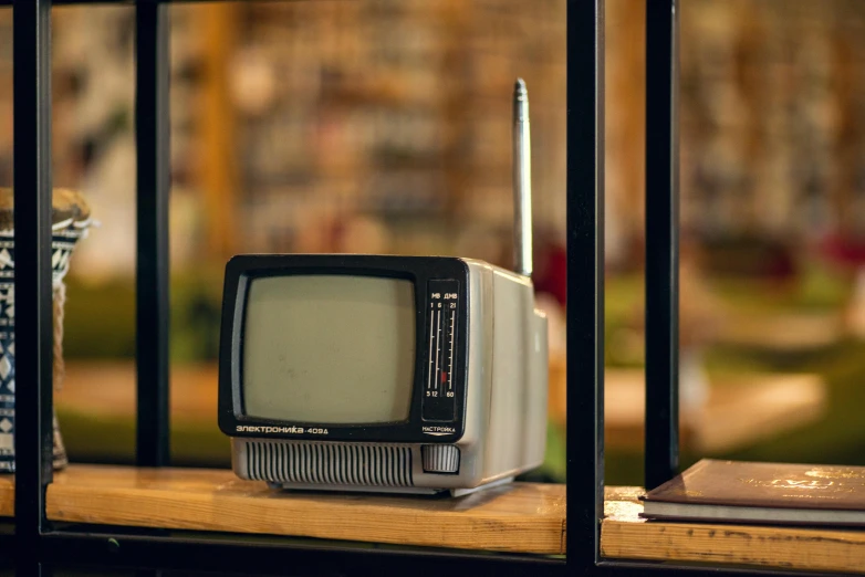 an old television sitting on top of a table