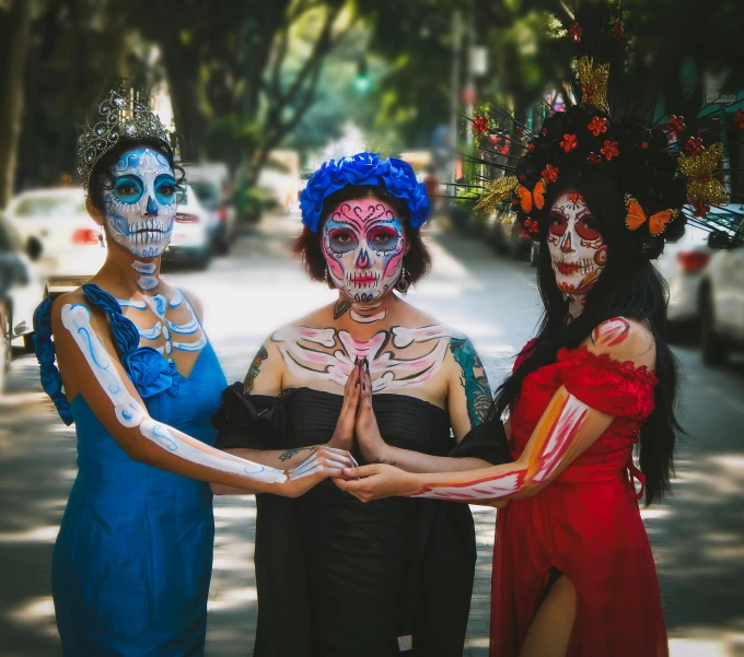 three women with their arms around one another