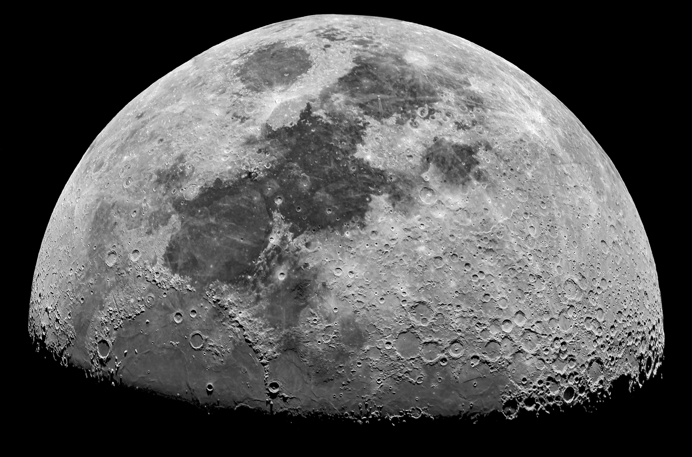 the side of the moon showing its clouds and side of the moon