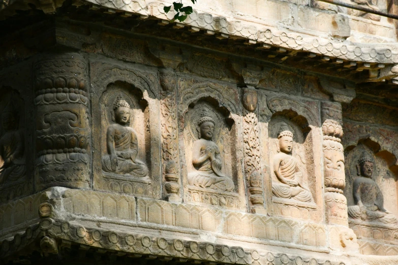 intricately carved stone carvings on the side of a large building