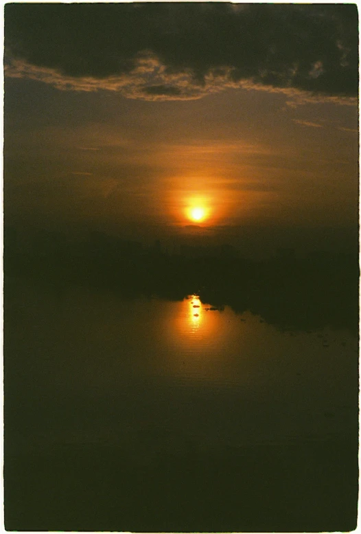 the sun shining through a cloudy overcast sky