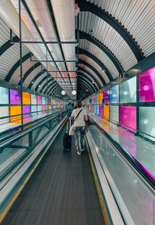 people are riding their luggage on the roller coaster