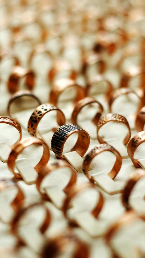 some rings on a table that is brown and black