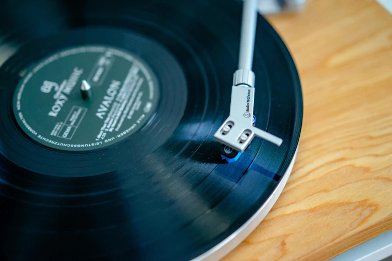 an antique record player sitting on top of a wooden surface