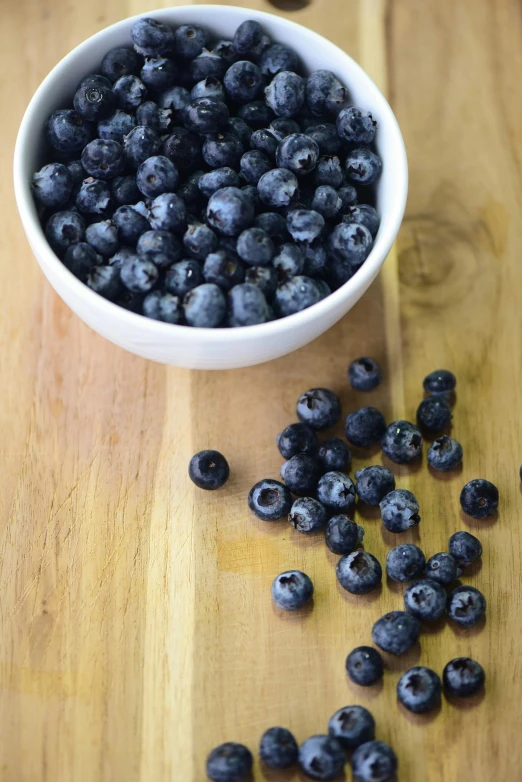 a small bowl of blueberries on a table