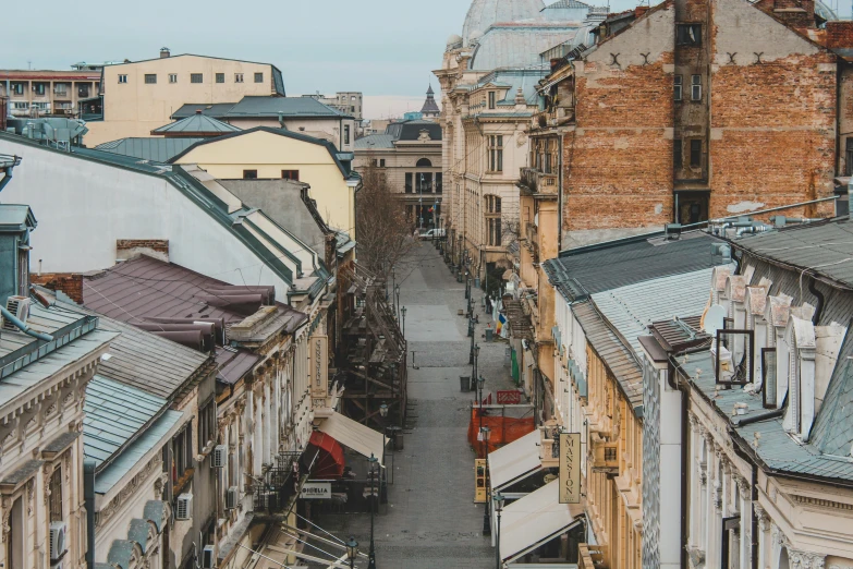 old buildings line up an alley with shops