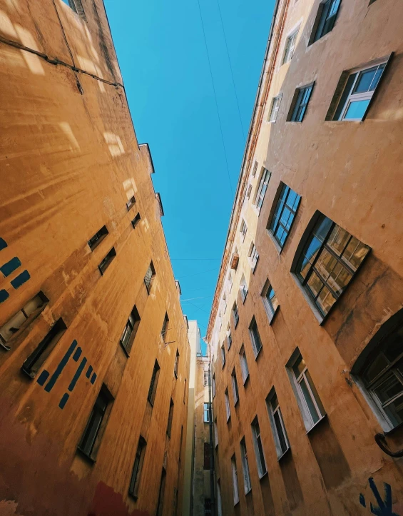 looking up at two buildings on a clear day