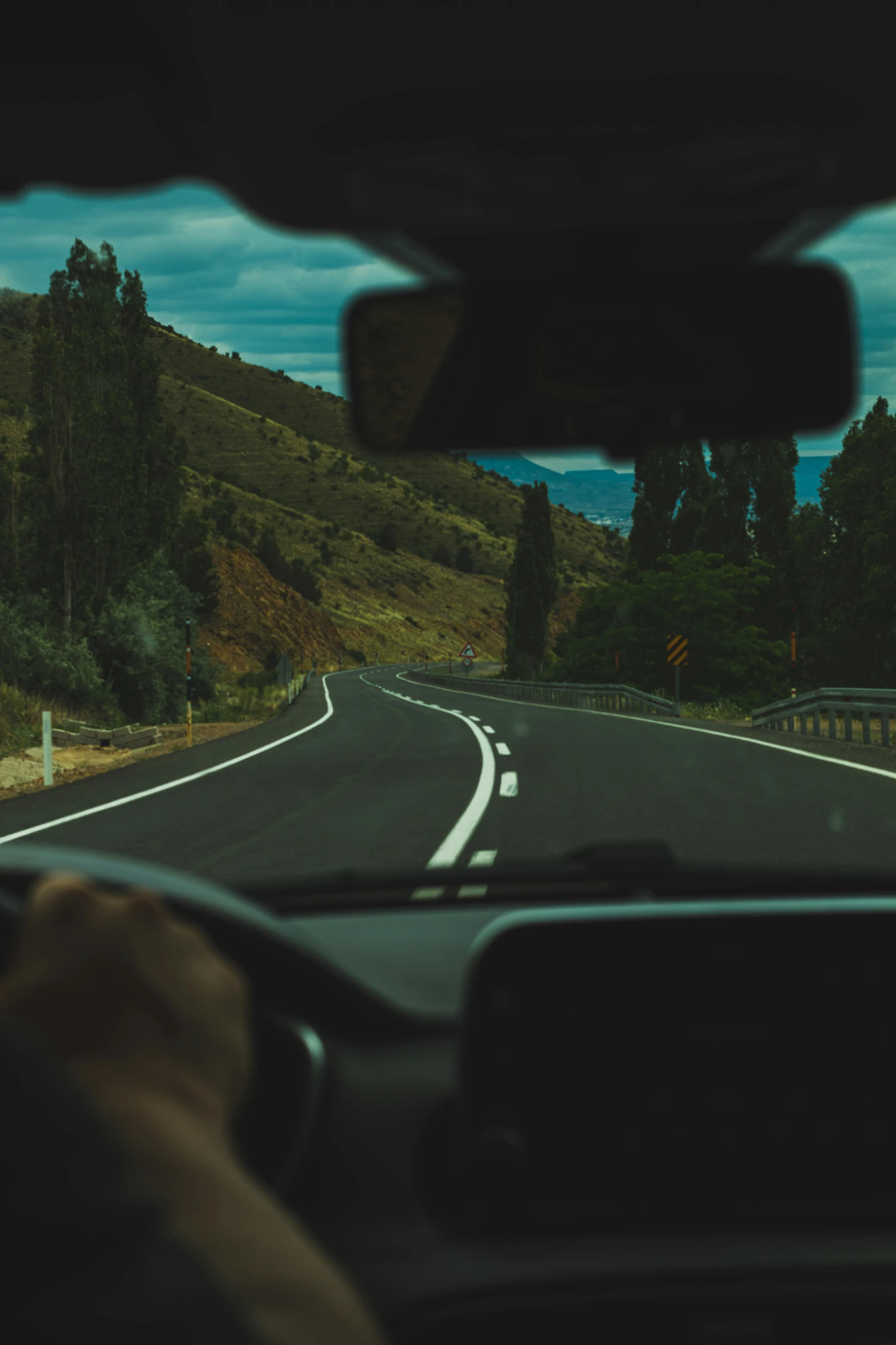 view from inside car driving down the road