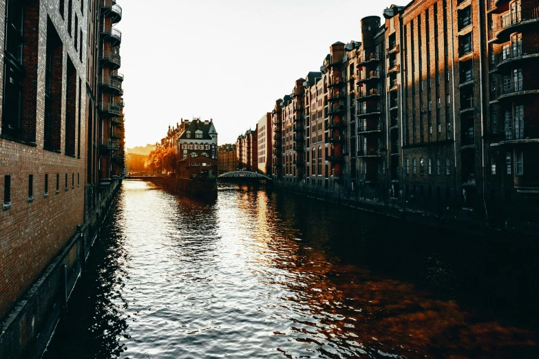 a canal next to some buildings near a river