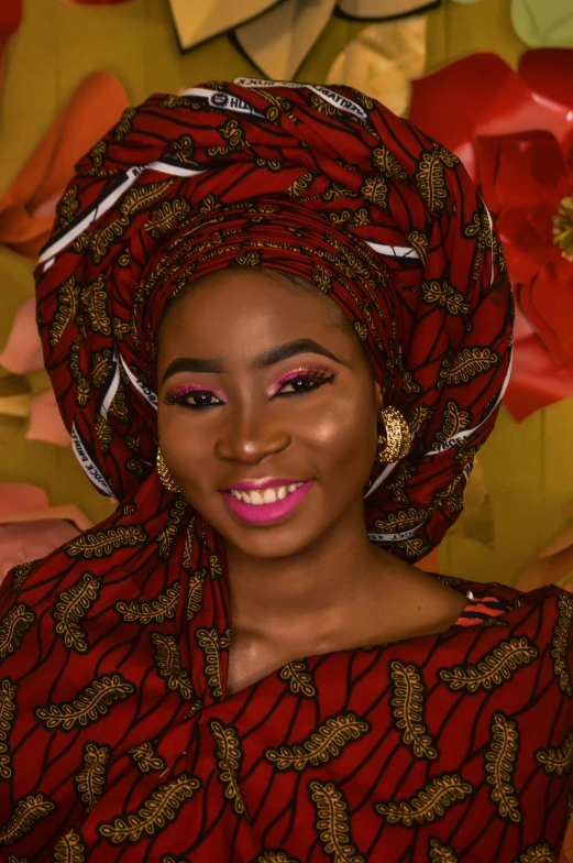 an african american woman with a large red turban on her head