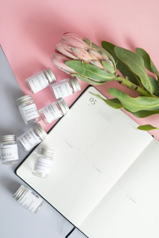 a notebook with a bunch of jars on top of it