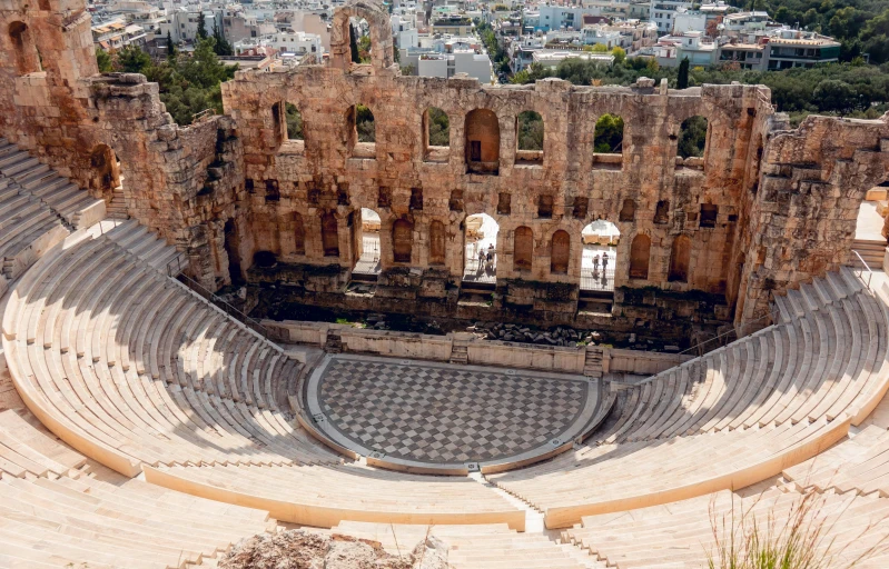 an old theater is seen above the city