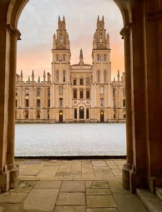 an archway view shows the historic architecture and beautiful scenery