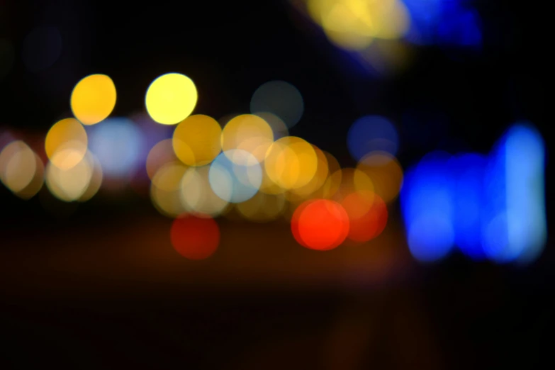 many colored blurry lights on a city street