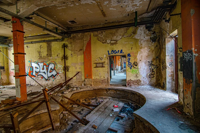 a run down room with graffiti on the walls