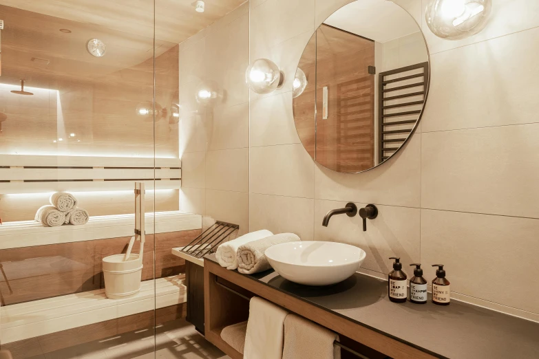 a sink sitting underneath a bathroom mirror in front of a tub