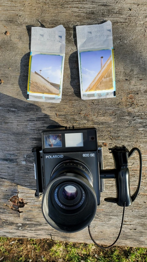 a camera and flash drive sitting on the sidewalk